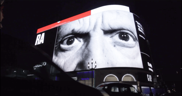 Picadilly advertisement screens showing a Picasso advert